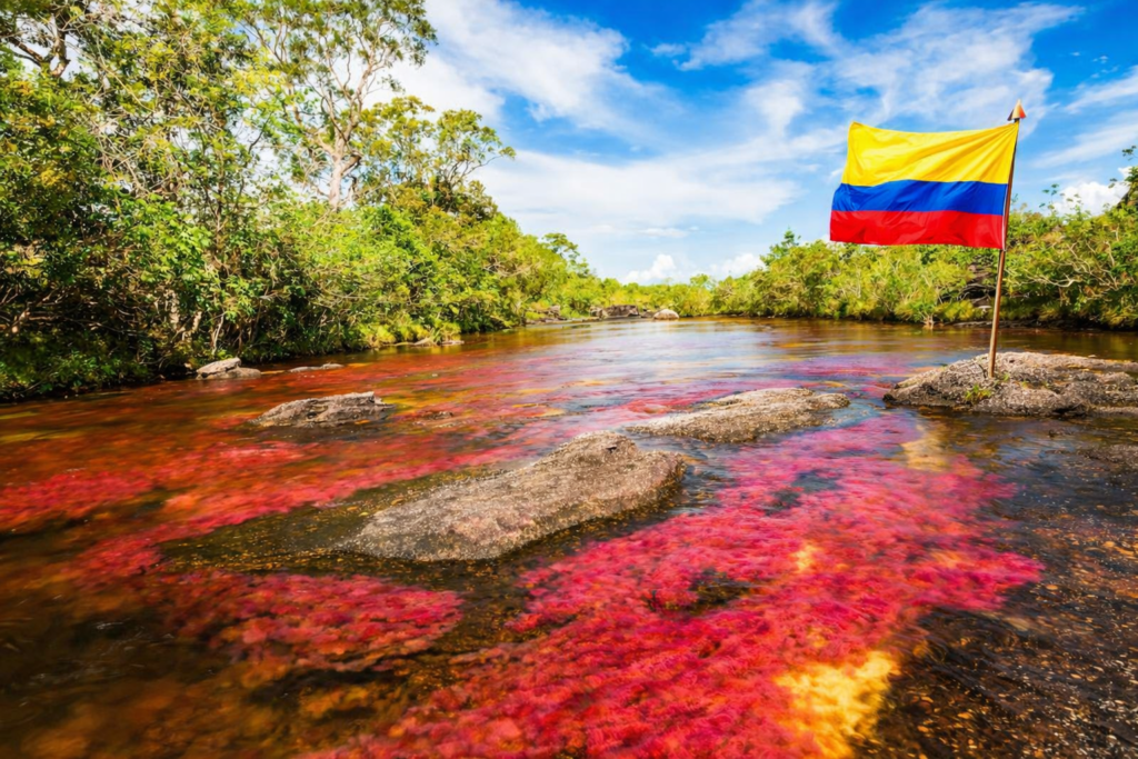 Rivière colorée en Colombie avec le drapeau colombien illustrant la diversité des paysages du pays